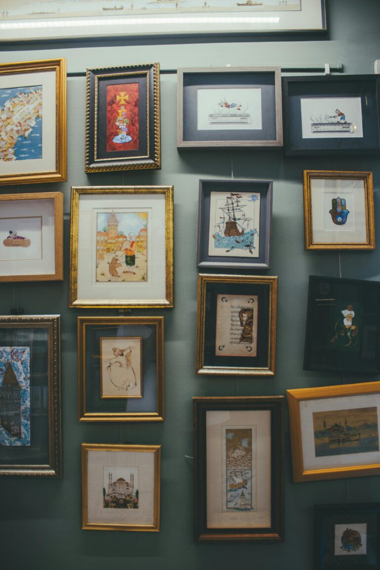 a collection of picture frames on one wall Logo