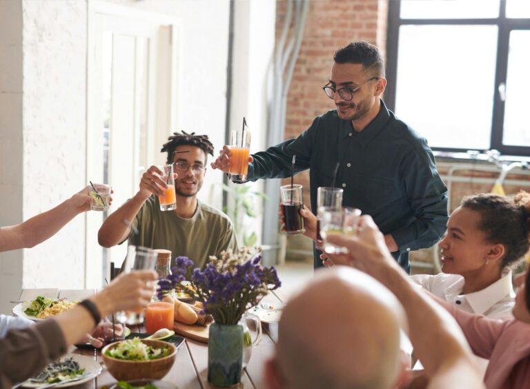 Group of friends making toast Logo